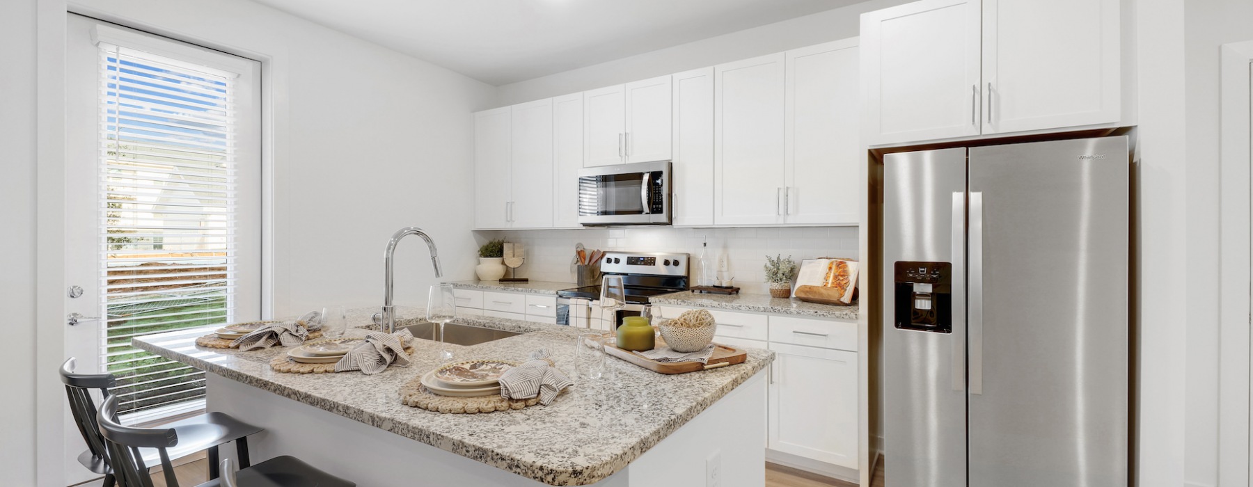 Stainless steel appliances in apartment kitchens at The Finch